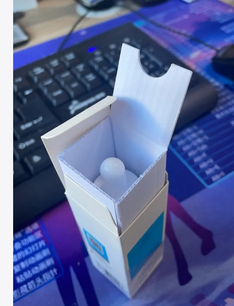 Real paperboard carton sample shown opened with product-fit detail